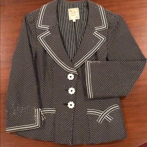 Black and white blazer.